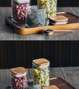 Detailaufnahme von quadratischen Glasbehältern mit Akazienholzdeckeln in einer Küche