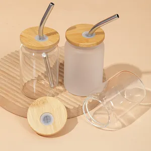 Detailed view of clear and frosted 3.5oz mini glass cans with bamboo lids and straws