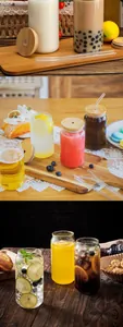 Macro view of 16oz glass can cups with bamboo lids and reusable glass straws
