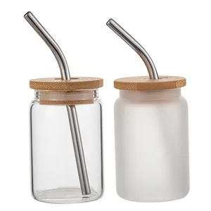Detail of 3.5oz glass jars with bamboo lids and stainless steel straws, clear and frosted