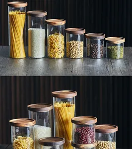 Vista detallada de tarros de cristal de borosilicato con tapas de madera herméticas.