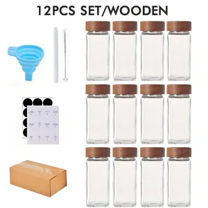 Complete view of 12-piece glass spice jar set with wooden lids and labeling kit