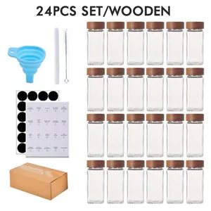 Comprehensive 24-piece clear glass spice jar set featuring acacia wood lids and accessories
