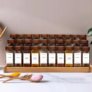Detail view of labeled spice jars neatly arranged on a tiered wooden rack display