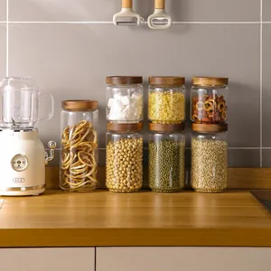 Set of glass storage jars with airtight acacia wood lids for kitchen organization