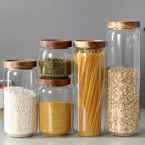 Set of airtight glass food storage jars with natural acacia wood lids for kitchen