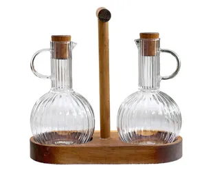 Détails des bouteilles d'huile en verre borosilicaté avec support en bois et bouchons