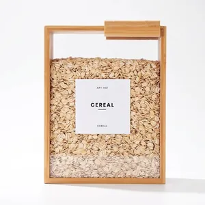 Macro view of large bamboo sliding lid cereal storage box filled with organic oats