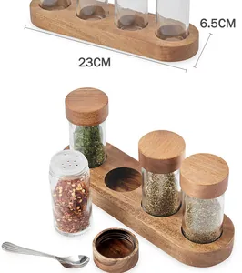 Detail of acacia wood spice jar set with 23cm base and glass bottles for seasonings