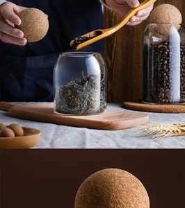 Close-up detail of spherical cork lid on high borosilicate glass storage jar