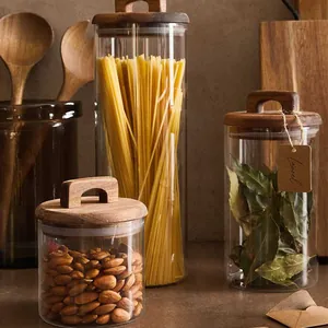 Set of three airtight glass food storage jars with natural acacia wood lids and handles
