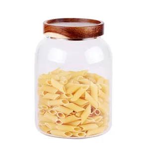 High borosilicate glass storage jar with an airtight acacia wood lid and penne pasta