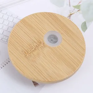 Eco-friendly natural bamboo lid with a silicone straw hole for glass Mason jars