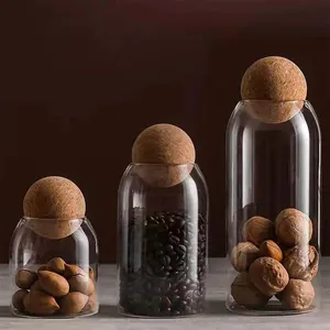 Set of 3 minimalist glass storage jars with spherical cork lids for food storage