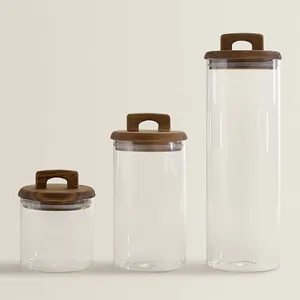 Set of 3 glass storage jars with acacia wood lids and U-shaped handles