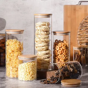 Set of clear round glass food storage canisters with airtight bamboo lids for kitchen