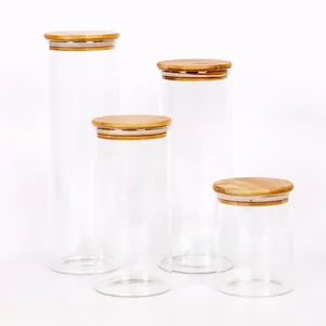 Set of 4 transparent glass food storage jars featuring airtight natural bamboo lids for kitchen