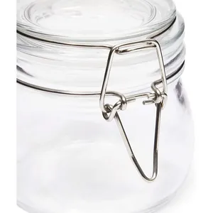 Macro view showing the durable stainless steel metal clasp on a clear glass storage jar