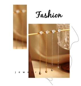 Detail shot of heart-shaped zircon long ear wires in both gold and silver color