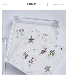 Detailed view of 3D embossed nail art stickers with colorful star-shaped rhinestones