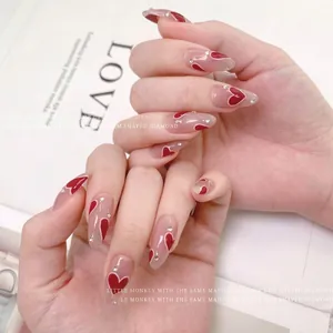 Elegant red heart-shaped nail stickers with rhinestones for a trendy summer manicure look