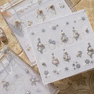 3D embossed Christmas nail art stickers with pearls, snowflakes, and fireworks patterns.