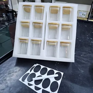 Set of 12 square glass storage jars with bamboo lids, black labels and white marker