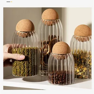 Ribbed glass storage jars with round cork ball lids for coffee beans and grains