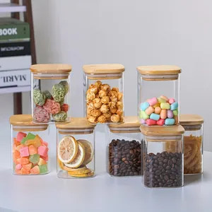 Set of square glass storage jars with bamboo lids for kitchen pantry organization