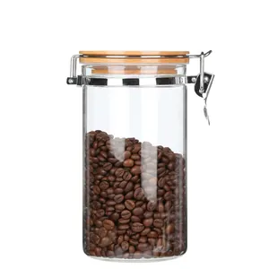 Close-up of a large airtight glass storage jar filled with coffee beans and a bamboo lid