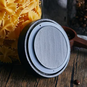 Detail view of premium black pine wood lid with white silicone sealing ring for kitchen jars