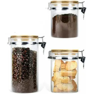 Set of three airtight borosilicate glass storage jars with bamboo lids and metal clamps.