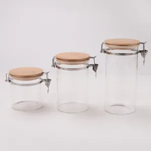 Set of three airtight borosilicate glass storage jars with bamboo lids in different sizes