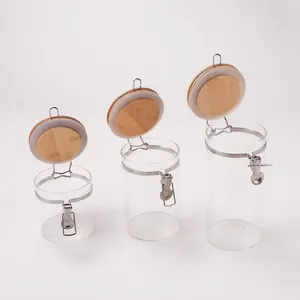 Detailed view of three borosilicate glass jars with bamboo lids and metal airtight buckles