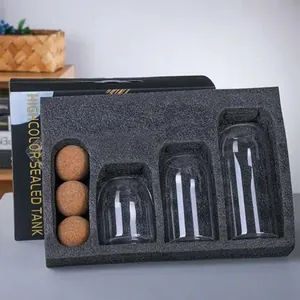 Glass storage jars set with cork ball lids for coffee beans and kitchen organization