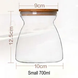 Transparent trapezoidal glass storage jar with bamboo lid and 700ml capacity