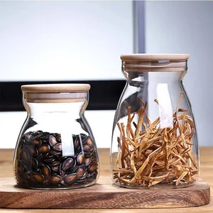 Detailed view of trapezoidal glass storage jars featuring eco-friendly bamboo lids