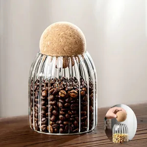 Elegant transparent ribbed glass storage jar with spherical cork ball lid for coffee beans