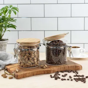 Transparent borosilicate glass jars with bamboo lids for airtight coffee and nut storage