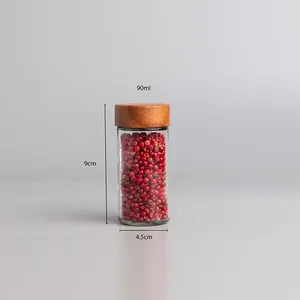Detail view of 90ml clear glass spice jar with acacia wood lid, size 9cm by 4.5cm