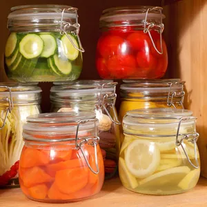 Close-up of airtight glass storage jars with metal clips and colorful food contents