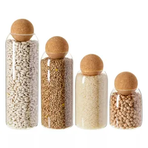Set of 4 minimalist clear glass storage jars with spherical cork lids for kitchen organization