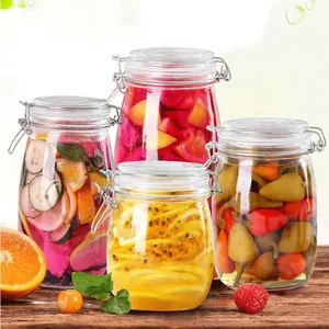 Detailed view of glass storage jars filled with colorful pickled fruits and peppers