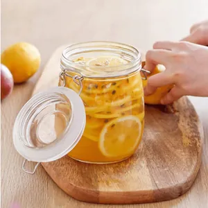 Airtight glass storage jar with metal clamp lid for preserving fresh lemon slices