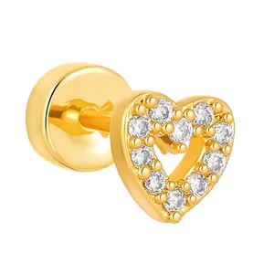 Macro view showing the fine detail of a gold heart stud earring set with clear zircon gems