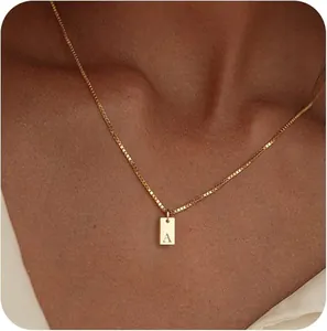 Close-up of a 18K gold-plated stainless steel necklace with engraved letter A pendant.