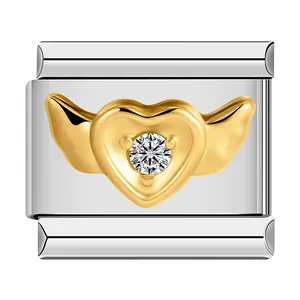 Detail view of Italian modular charm featuring a golden winged heart and sparkling stone