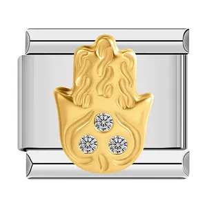Macro detail of Italian charm link featuring gold Hamsa hand with three crystals