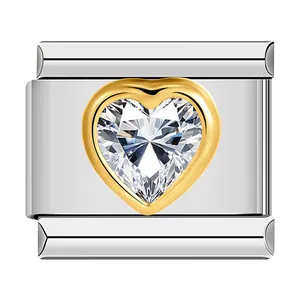 Detail of stainless steel heart modular charm with sparkling crystal in gold rim.