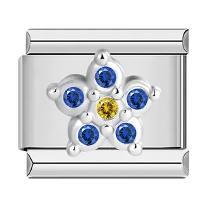 Close-up of stainless steel flower charm with blue and yellow cubic zirconia